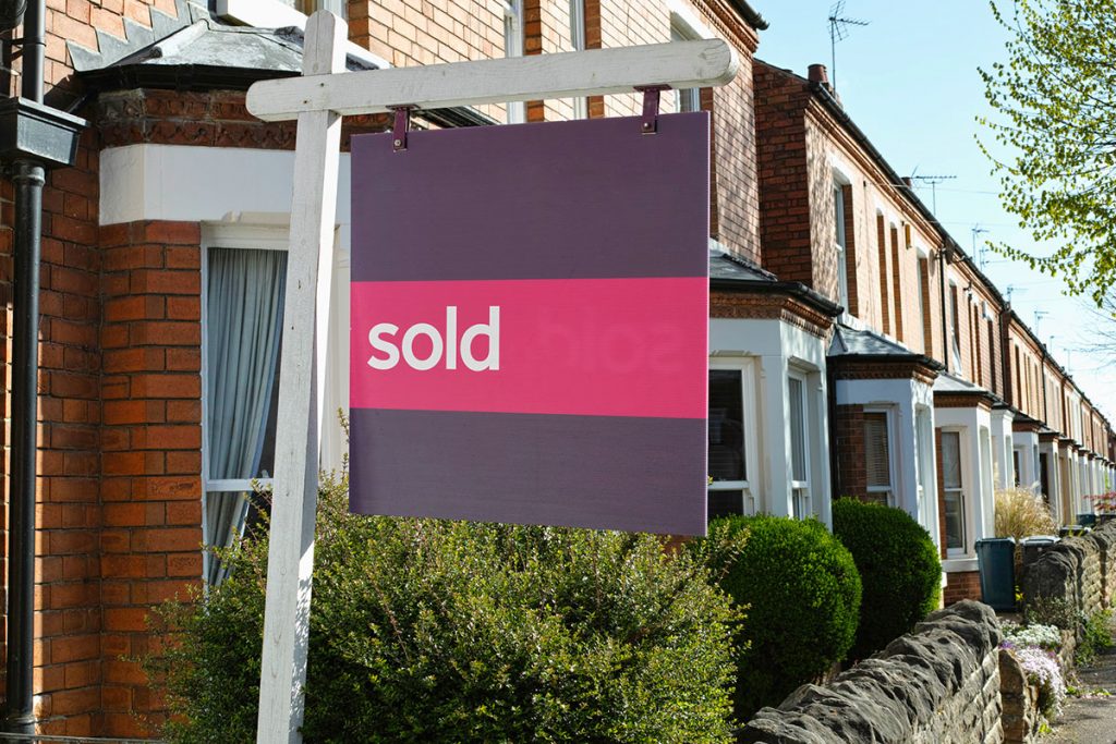 Sold sign on house
