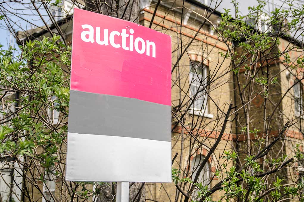 Auction sign on house