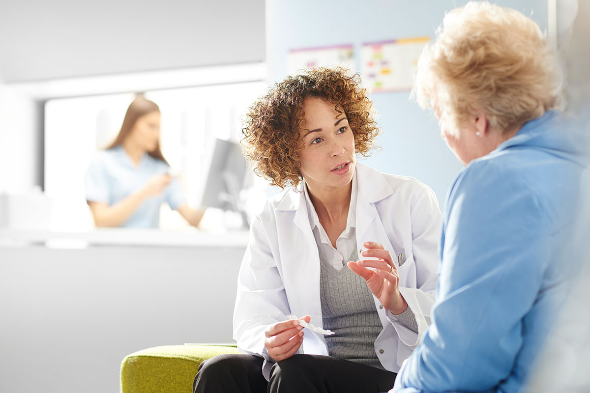 Nurse speaking to patient