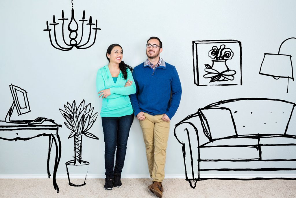 Couple with painted home background