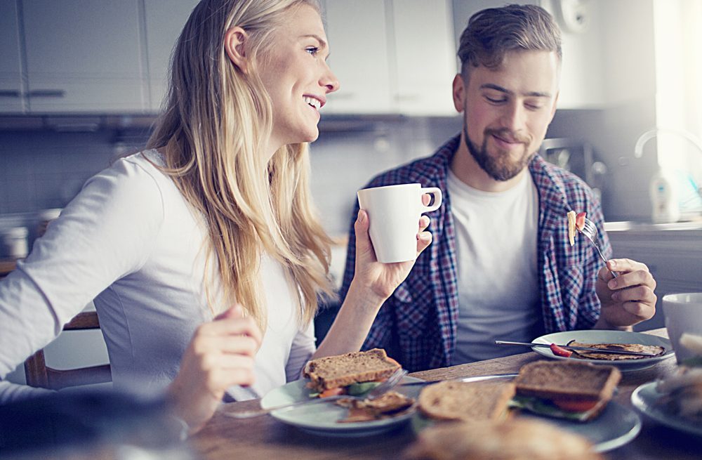 Young couple having breakfast