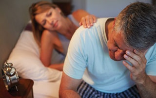 distressed man holding head