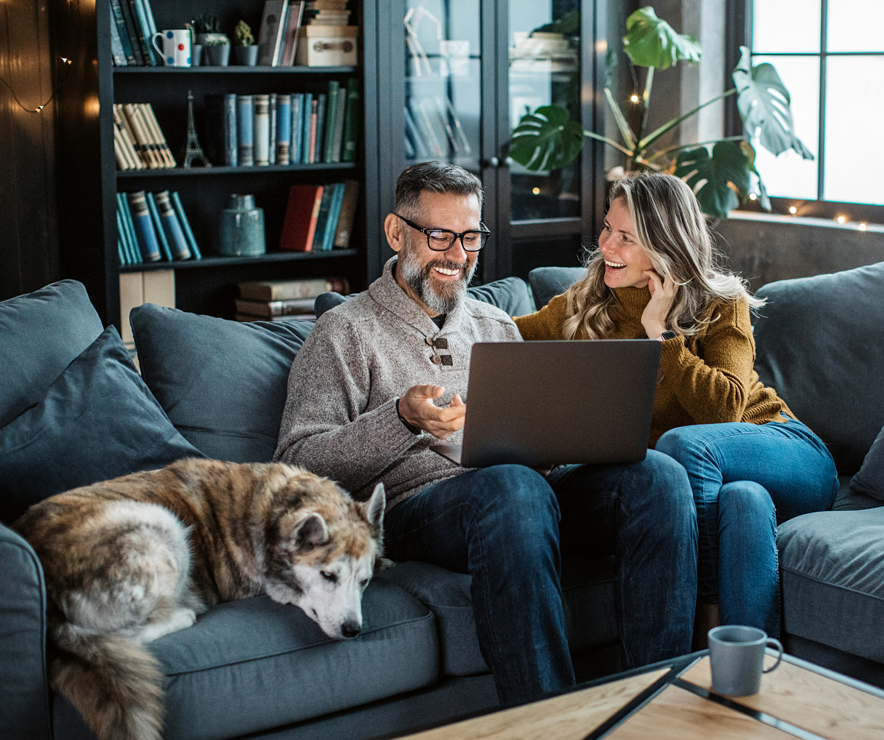 Couple at home with dog