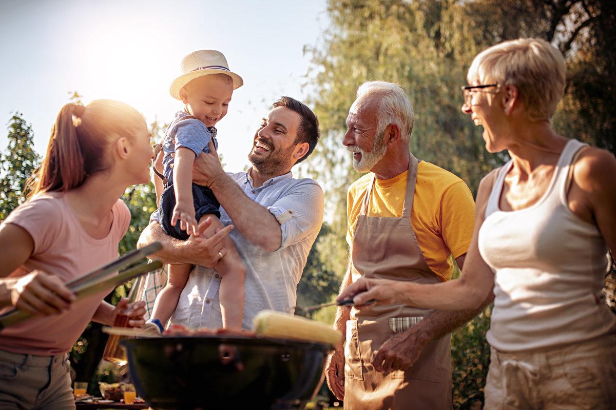 Family in garden BBQing