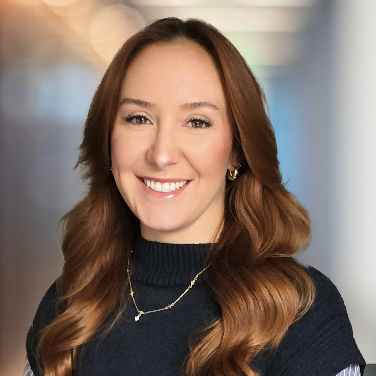 Modern office corridor with walls of glass defocused background. Danni West - Protection and GI Adviser