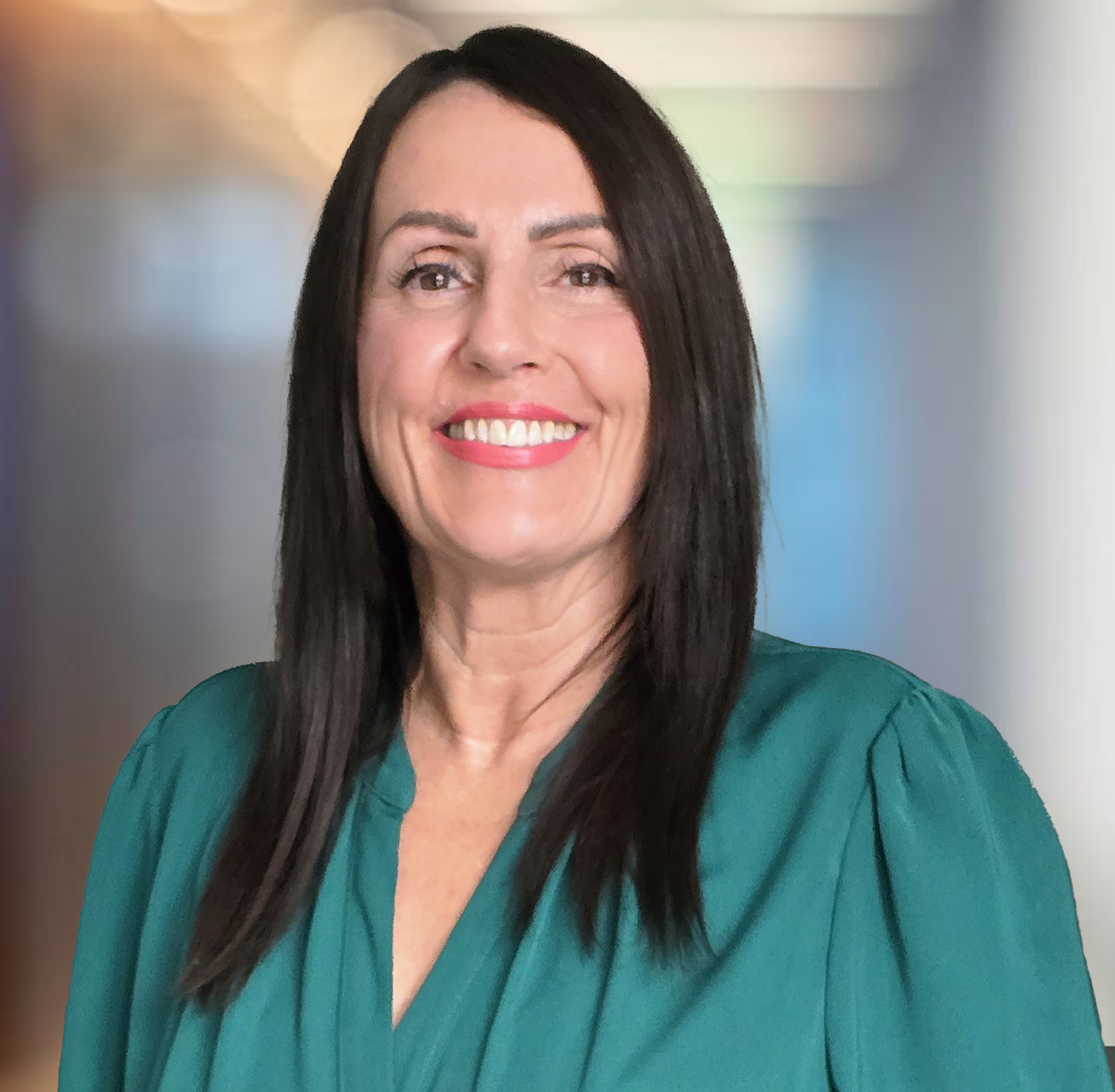 Modern office corridor with walls of glass defocused background. Fiona Elliott - Case completions Manager